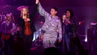 Julie Dutchak and Mari Anne Jayme make one soldier feel special as they sing "A Natural Woman" to him.