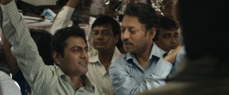 Saajan's replacement Shaikh (Nawazuddin Siddiqui) drops some knowledge on him during a typically cramped train ride.