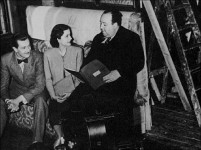 Alfred Hitchcock directs actors Michael Redgrave and Margaret Lockwood in this still set to Truffaut's interview of the director.