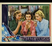 Iris and her friends (Googie Withers and Sally Stewart) enjoy cocktails in this colorized lobby card from the stills gallery.