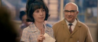 Rita O'Grady (Sally Hawkins) takes offense at the Ford Motor Company's response to the single-day machinist work stoppage, to the out-of-focus delight of union organizer Albert (Bob Hoskins).