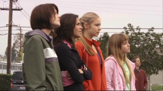 Emily (Chelsea Hobbs), Kaylie (Josie Loren), Payson (Ayla Kell), and Becca (Mia Rose Frampton) arrive at the new home of their old coach but have second thoughts about going in.