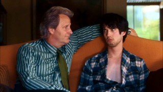 Potential stepfather Mert Rosenbloom (Jeff Daniels) and stepson (Jon Heder) exchange hostile looks.
