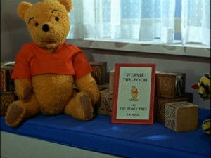 In the opening live-action segment, Pooh Bear is perched in Christopher Robin's bedroom.