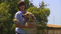 Dog trainer Mathilde de Cagny is embraced by her pupil Clyde in "Finding Marley."