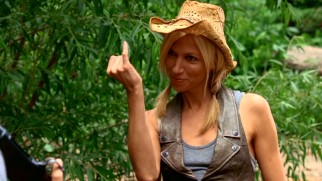 Environmental activist Dr. Nikki Riley (Debbie Gibson) stands up to redneck hunters with a pinky penis joke.