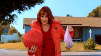 Frankie (Patricia Heaton) tries to motivate Brick athletically with a kicks for candy program.