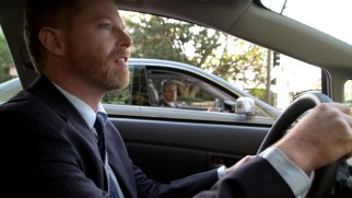Mitchell (Jesse Tyler Ferguson) fears his boss may have just heard himself badmouthed through his car window at their shared traffic light.