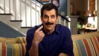 "You too, brother." Phil Dunphy (Ty Burrell) proudly points out his latest accessory, a fake mustache.