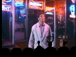 As he exits this liquor store, one suspects alcohol doesn't agree with "writer" Paul Niles (Fred Cavalli).