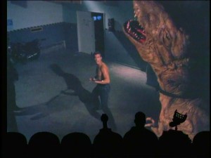 If it looks like Jean-Claude Van Damme and the wizards at ILM have teamed up to bring you this awesome man-versus-dinosaur scene, please take a closer look.