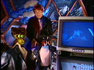 Second host Mike (Michael J. Nelson), Crow, and Tom Servo don wigs and sing a doo-wop ditty inspired by the driving werewolf of "Werewolf."