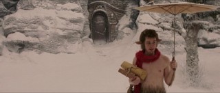 A faun (James McAvoy, playing Mr. Tumnus) with packages and an umbrella in the snow... This is said to have been the image that inspired C.S. Lewis to write "The Chronicles of Narnia."
