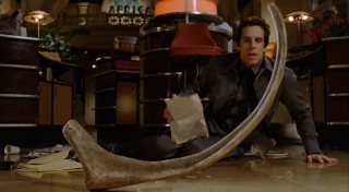 A dinosaur bone lands awfully close to Larry in the first of his many exciting museum encounters.