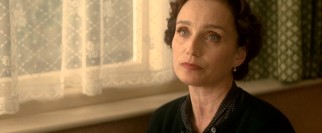 Kristin Scott Thomas plays John Lennon's aunt Mimi Smith, a stern but loving guardian.