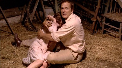 Patrick Fabian looks directly into the camera, as Rev. Cotton Marcus tries to console the tormented rural teen girl he's hired to perform an exorcism on.