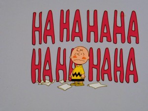 In love Charlie Brown gets surrounded by giant Ha Ha's. These laughs aren't the good "you're so funny" kind, but the bad "let's laugh at that silly blockhead" ones.
