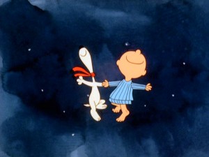 Upon a happy reunion, Snoopy and Charlie Brown do a happy dance together somehow in the starry night sky.