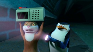 No, Marlene, a Nicole Sullivan-voiced otter created for the series is not having a Lloyd Dobler moment. She and Skipper are playing her snore recordings for a sewer creature.