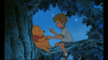Christopher Robin tries his best to scare Pooh with a twilight E.T. impression. This screencap was taken from the feature itself, presented in widescreen.