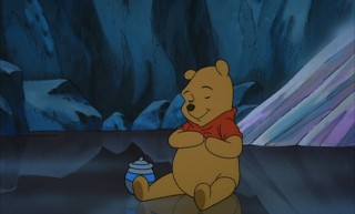 Pooh sits contently, knowing that the rumbly in his tumbly won't last much longer.