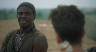 Undereducated but good-natured King (Keith David) becomes a close friend to Chris Taylor.