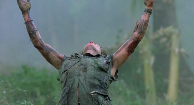 In the iconic shot by which "Platoon" has long been represented, a downed Sgt. Elias (Willem Dafoe) reaches up to the heavens for salvation.