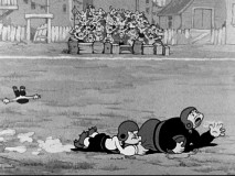 Popeye tackles Bluto as the two are seen at a young age in "The Football Toucher Downer", which also includes Wimpy and Olive as spectators.