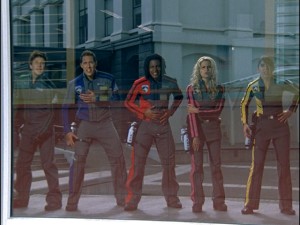 The Power Rangers are caught in Mirloc's reflective attire, and thus they turn up as reflections in a window. When you really think about it, that doesn't make any sense.