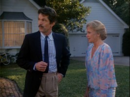Susan (pretending to be Sharon) flounders in explaining her current predicament to the "handsome" Bill Grand (Tom Skit-Skat-Skerritt).