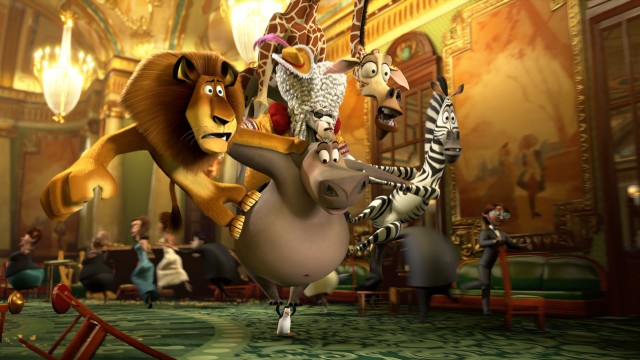 Alex, Gloria, Melman, Marty, and two chimps disguised as the King of Versailles make a messy getaway from a Monte Carlo casino on a penguin's flippers in "Madagascar 3: Europe's Most Wanted."