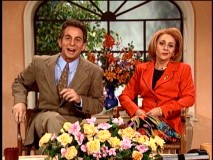 On "Live with Regis and Kathie Lee", Kathie Lee Gifford (Nicole Sullivan) addresses her 1996 sweatshop scandal with a clip from a telemovie.