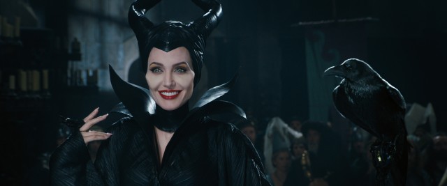 Maleficent (Angelina Jolie) crashes the christening of the infant princess Aurora in Disney's "Maleficent."