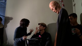 Only on a horror movie set can you find Jessica Chastain consulting with director Andy Muschietti without any acknowledgement of the creepy giant in the room.