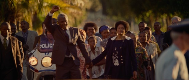 In "Mandela: Long Walk to Freedom", Nelson Mandela (Idris Elba) makes a fist as he walks out from prison with Winnie (Naomie Harris) by his side after serving 26 years of a life sentence.
