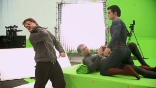 Director Zack Snyder shows Michael Shannon (General Zod) and Henry Cavill (Superman) what he's looking for in their green screen duel in "All-Out Action."