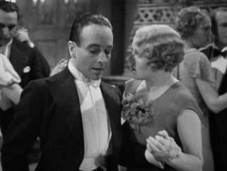 Dying spy Louis Bernard (Pierre Fresnay) slips Mrs. Lawrence (Edna Best) some important information.