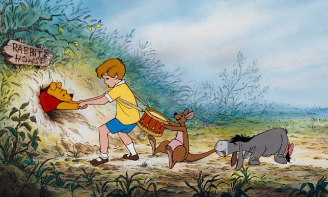 Christopher Robin, Kanga, and Eeyore try to help get Winnie the Pooh unstuck from Rabbit's doorway in the first third of "The Many Adventures of Winnie the Pooh."