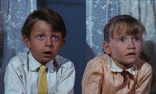 Michael (Matthew Garber) and Jane Banks (Karen Dotrice) are shocked to find the wind blowing in their umbrella-wielding new nanny.