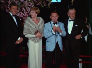Dick Van Dyke, Julie Andrews, and Walt Disney are interviewed at Mary Poppins' Gala World Premiere at Grauman's Chinese Theater.