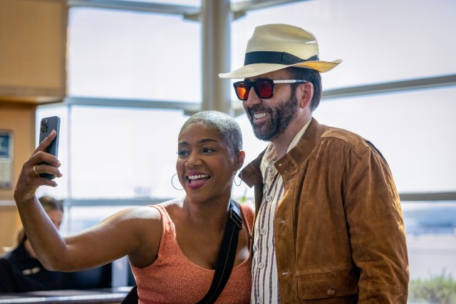 Nic Cage (Nicolas Cage) poses for a selfie with a "Croods 2" fan he doesn't know is FBI agent Vivian (Tiffany Haddish) in "The Unbearable Weight of Massive Talent."
