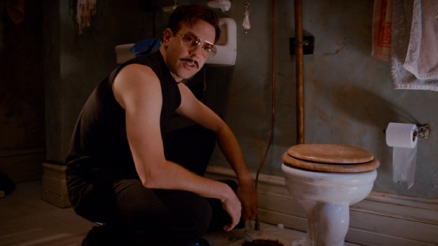 Jason Sudeikis gives the film's funniest performance as mustachioed hired hitman Mike McKinney.