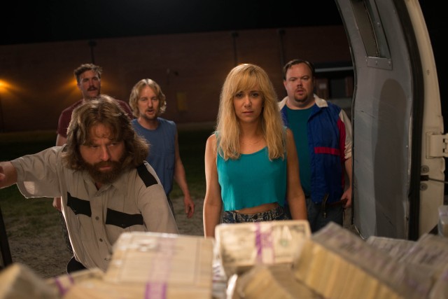 David Ghantt (Zach Galifianakis) shows off the fruits of his labors, an armored truck holding $17 million in cash to Kelly Campbell (Kristen Wiig) and friends in "Masterminds."