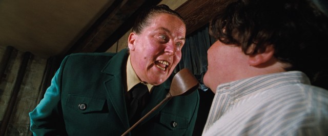Trunchbull (Pam Ferris) insists that Bruce Bogtrotter eat the entirety of a giant chocolate cake.