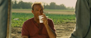 Coach White (Kevin Costner) develops a further appreciation for his boys after joining them for a typical day of back-breaking field labor.