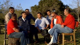 Members of the actual 1987 McFarland cross country team sit down for a scenic outdoor chat with Coach White and Kevin Costner in "McFarland Reflections."