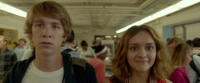 Greg (Thomas Mann) and Rachel (Olivia Cooke) take in the sights of their high school's narrow cafeteria.