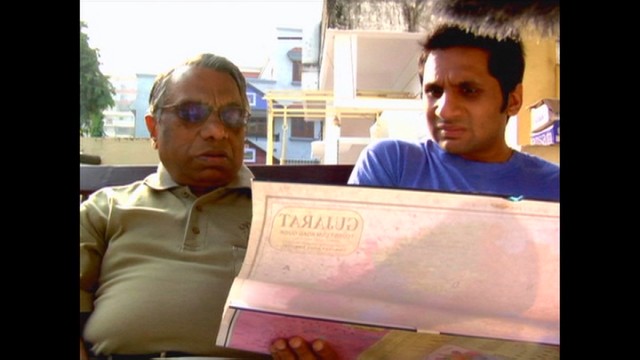 Vasant Patel uses a map to show his son Ravi the areas of India where Patels come from in "Meet the Patels."