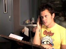 A single-headed Johnny Knoxville records automated dialogue replacement for both Scrad and Charlie.