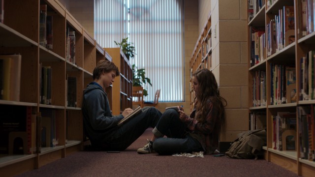 Teen couple Tim Mooney (Ansel Elgort) and Brandy Beltmeyer (Kaitlyn Dever) have an old-fashioned sense of romance that involves meeting in secret and library floor face-to-faces.